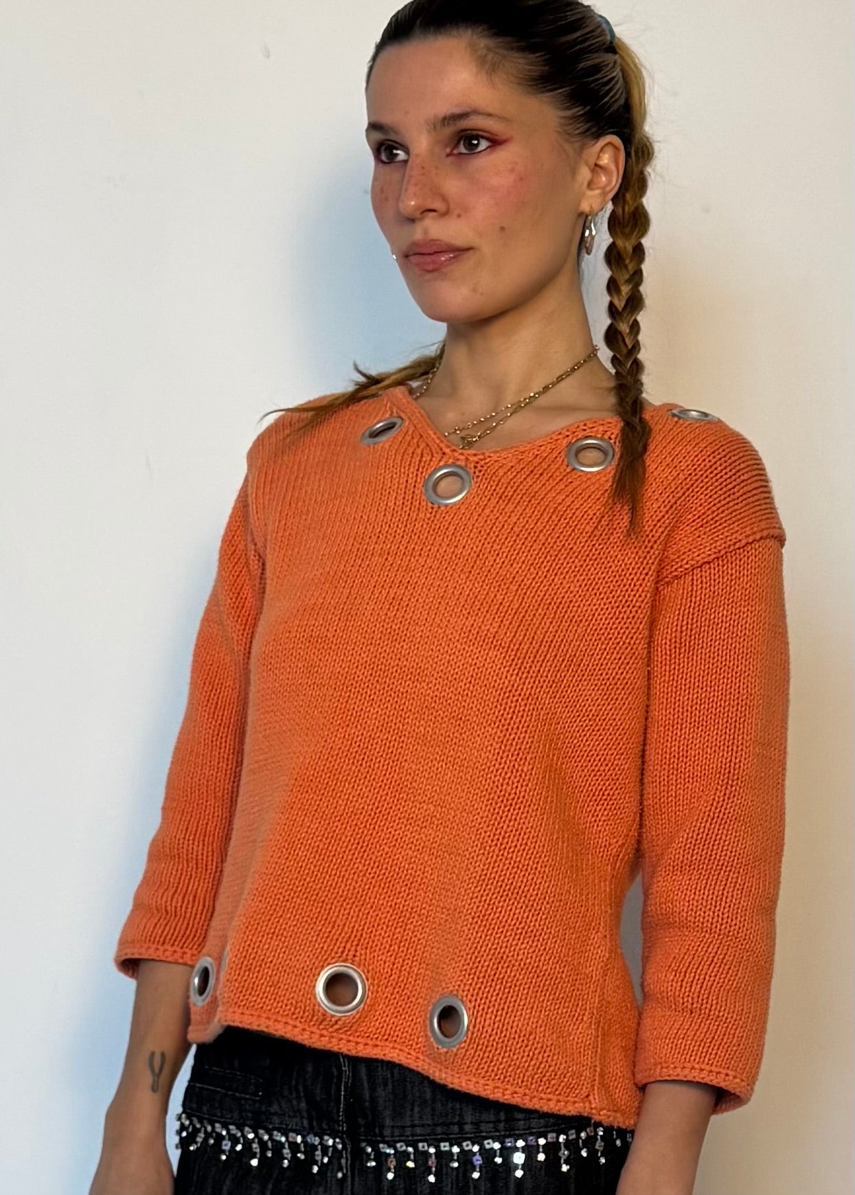 Orange grommet sweater